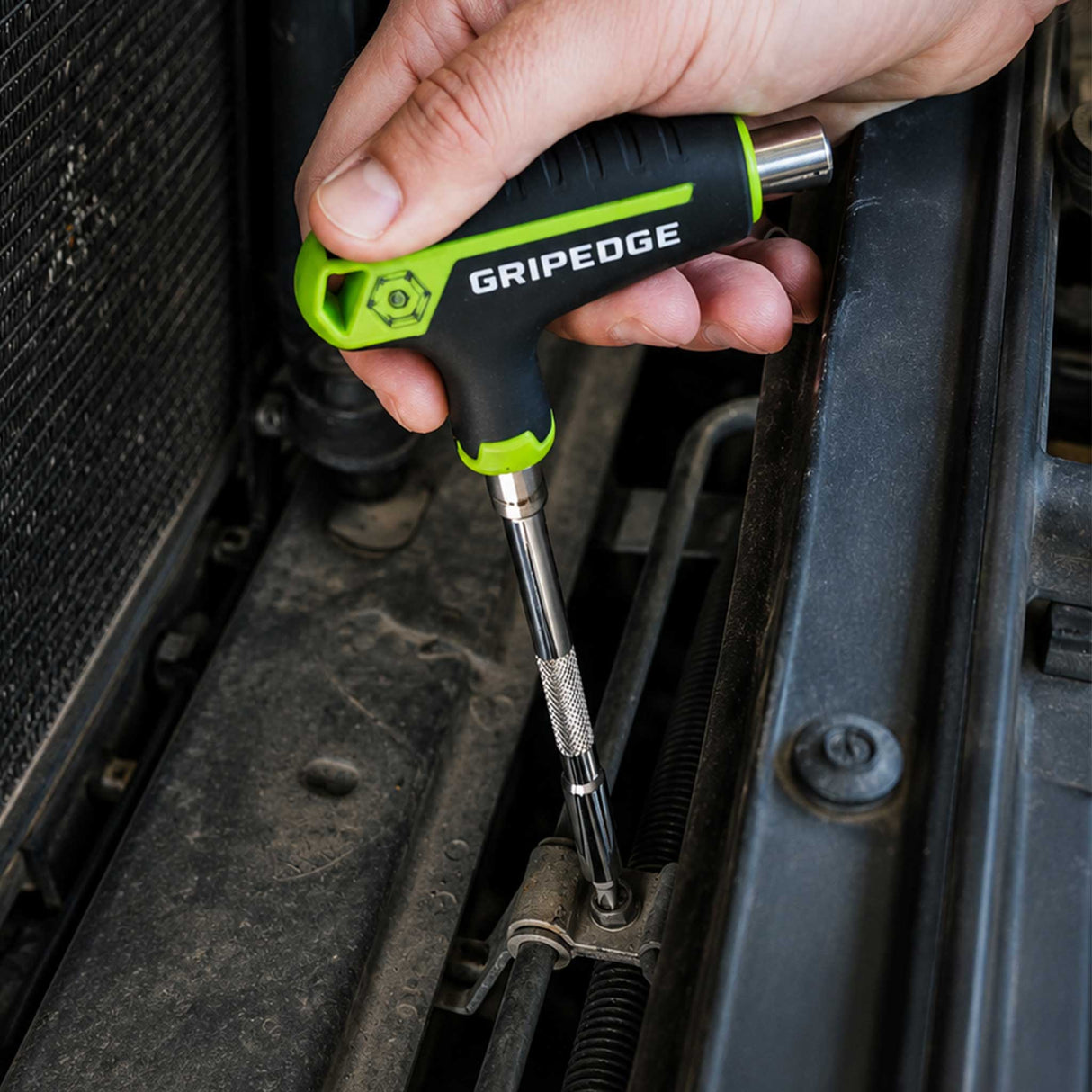 GripEdge multi-bit driver reaching fasteners inside an engine compartment